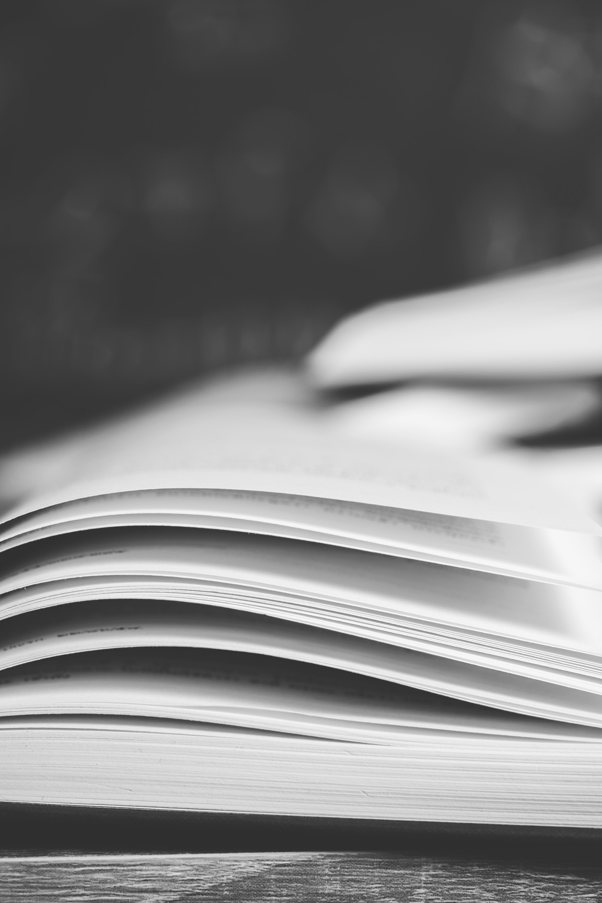 An open book on a wooden desk